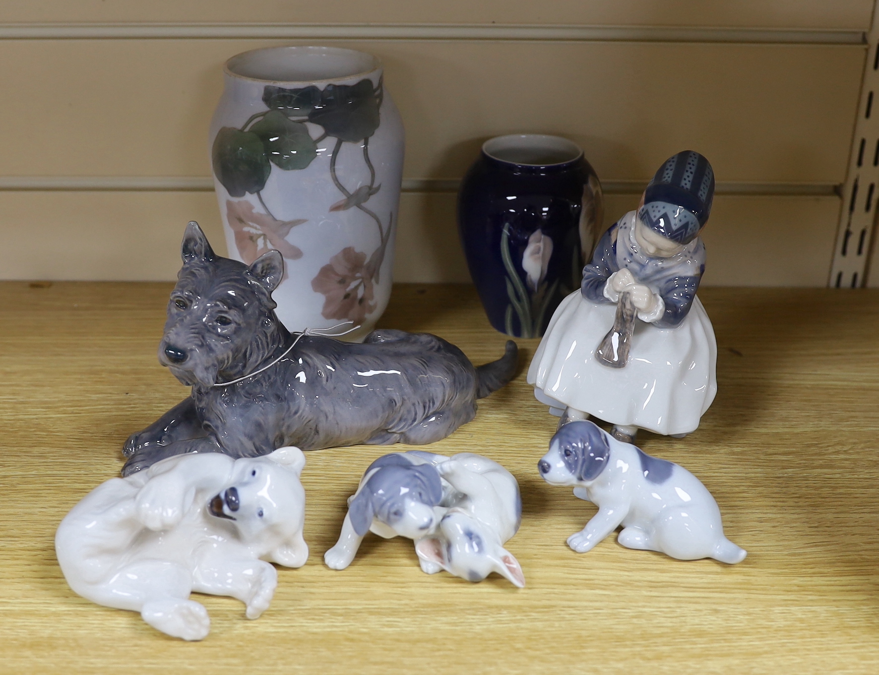 Four Royal Copenhagen figures and animals, two similar vases and a Bing and Grondahl terrier